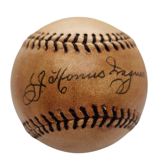 A detailed view of the Sports Integrity Honus Wagner Pirates Replica Baseball, showcasing dark stitching and a circa 1910s facsimile autograph elegantly printed on the leather surface.