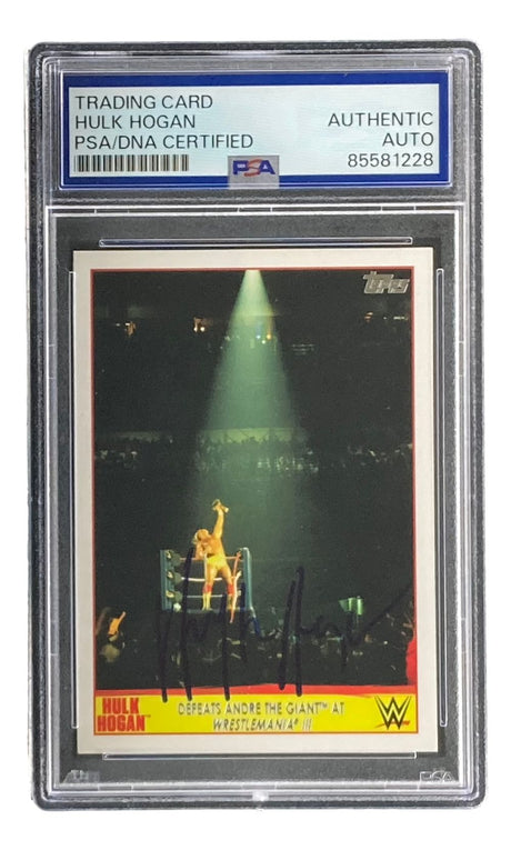 The Hulk Hogan Signed 2015 Topps WWE Wrestlemania #5 Trading Card by Sports Integrity features PSA/DNA certification and an autograph, capturing Hogan’s ring celebration after defeating André the Giant at WrestleMania III.