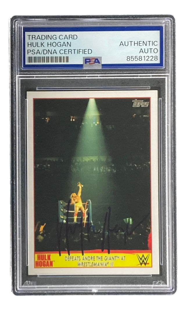 The Hulk Hogan Signed 2015 Topps WWE Wrestlemania #5 Trading Card by Sports Integrity features PSA/DNA certification and an autograph, capturing Hogan’s ring celebration after defeating André the Giant at WrestleMania III.
