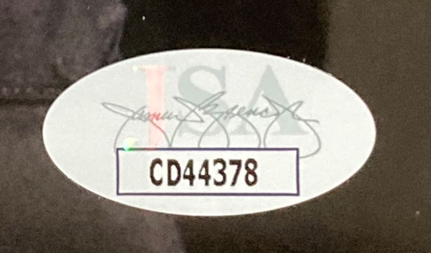 Oval sticker with faint JSA logo and black cursive writing, plus a white rectangle showing bold black text CD44378. Item: Ice Cube Signed Framed 8x10 Photo JSA by Sports Integrity.