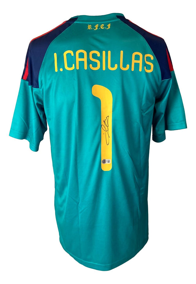 The Sports Integrity Iker Casillas Signed Spain Adidas Soccer Jersey BAS features teal and navy colors, yellow lettering, I. Casillas and number 1 on the back with his signature below, plus "R.F.E.F" printed on the upper back.