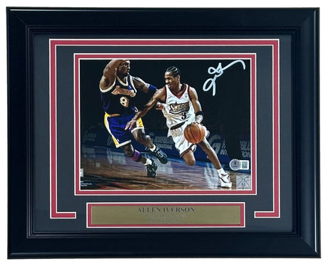 The Sports Integrity Allen Iverson Signed Framed 8x10 Philadelphia 76ers vs Kobe Bryant Photo features Iverson dribbling, his white signature at the top right, and includes a gold name plaque. Authenticated by BAS.