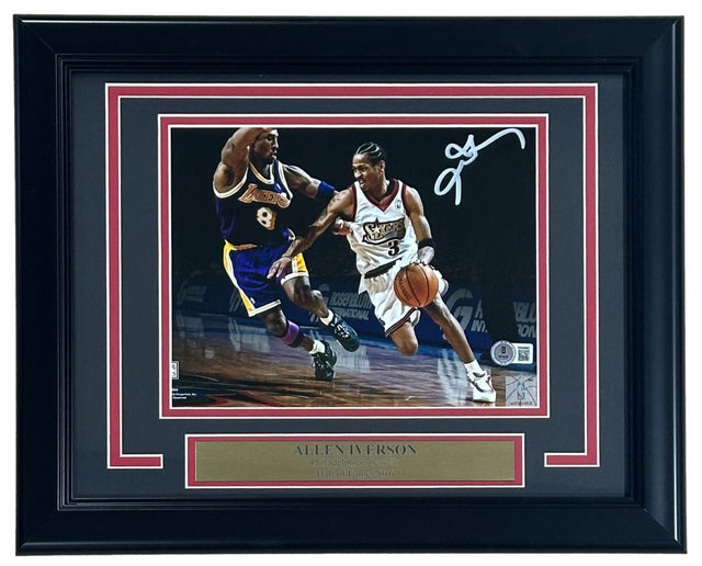 The Sports Integrity Allen Iverson Signed Framed 8x10 Philadelphia 76ers vs Kobe Bryant Photo features Iverson dribbling, his white signature at the top right, and includes a gold name plaque. Authenticated by BAS.