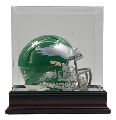 A Sports Integrity Jalen Carter signed Eagles Kelly Green mini helmet is showcased in a clear display case with "Super Bowl LIX Champions" and the Eagles logo printed on the front, featuring a black base.