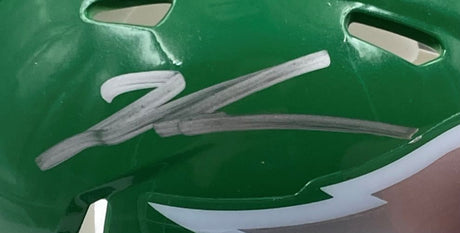 The Sports Integrity Jalen Carter Signed Eagles Kelly Green Mini Helmet features a bold silver autograph and comes with a Super Bowl 59 LIX case, plus white detailing near the lower edge.