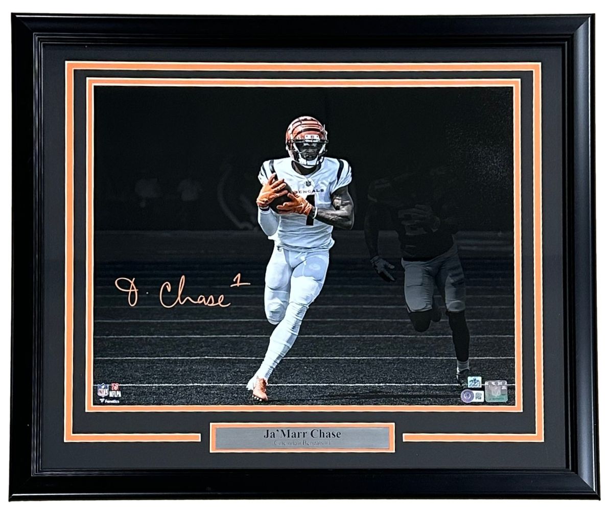 Sports Integrity Ja'Marr Chase Signed Framed 16x20 Cincinnati Bengals Spotlight Photo BAS, featuring Chase in uniform running with the ball, dark background, and a nameplate below the photo.