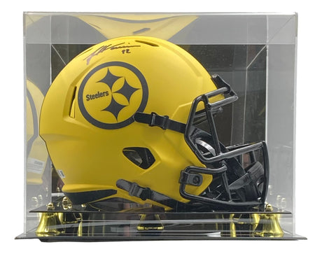 The Sports Integrity James Harrison Signed Steelers FS Rave Speed Replica Helmet, featuring a yellow design with black accents and logo, comes autographed and displayed in a clear acrylic case.