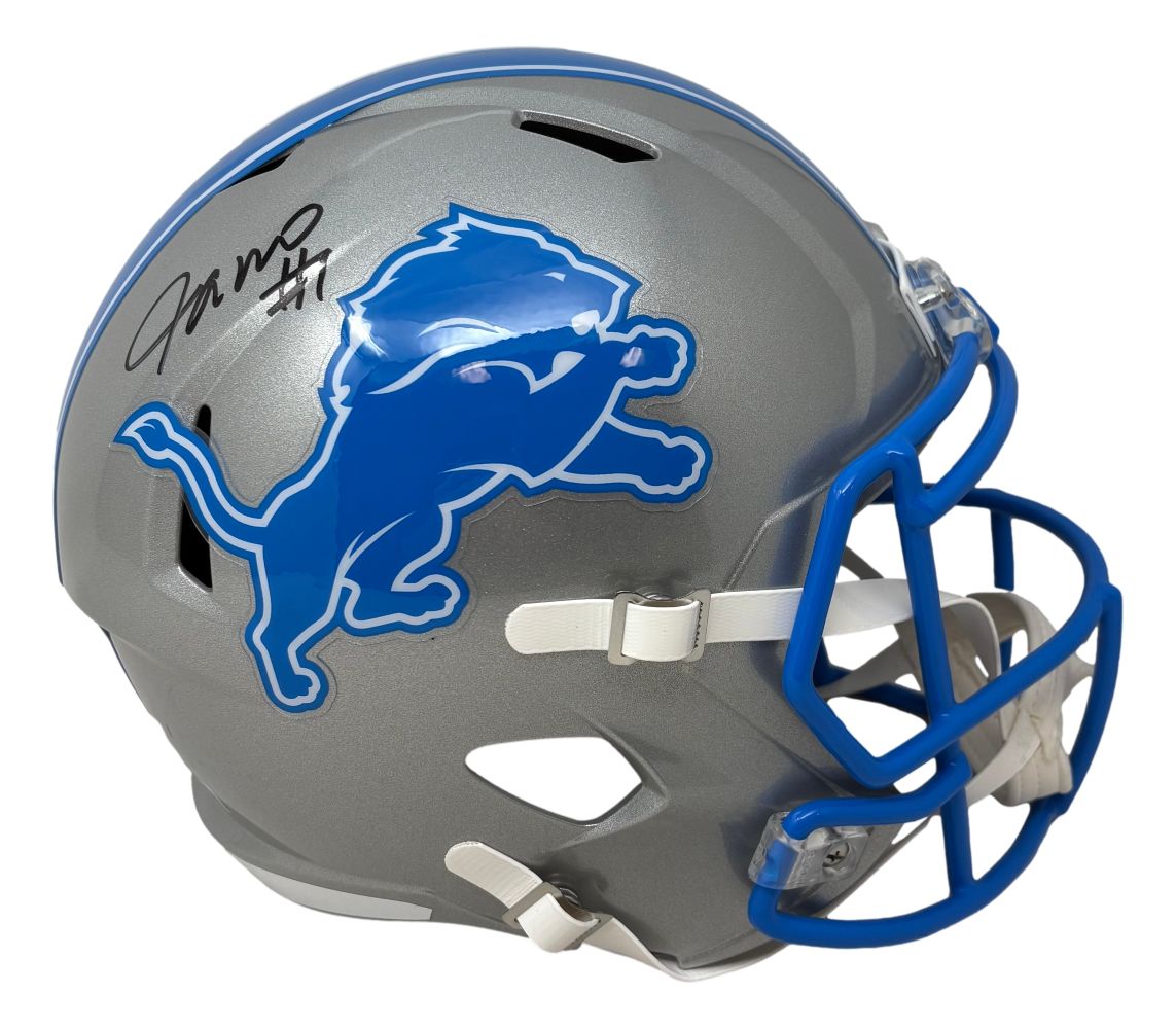 The Jameson Williams Signed Detroit Lions Full Size Speed Replica Helmet by Sports Integrity features a silver design with a blue lion logo, blue facemask, black autograph, and number 11 on the top left side.
