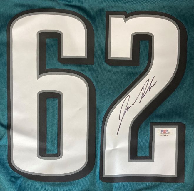 The Jason Kelce Signed Philadelphia Eagles Nike Game Replica Jersey by Sports Integrity features a teal design, large white number 62 with Kelce's black signature on the right digit, and a PSA ITP hologram sticker below.