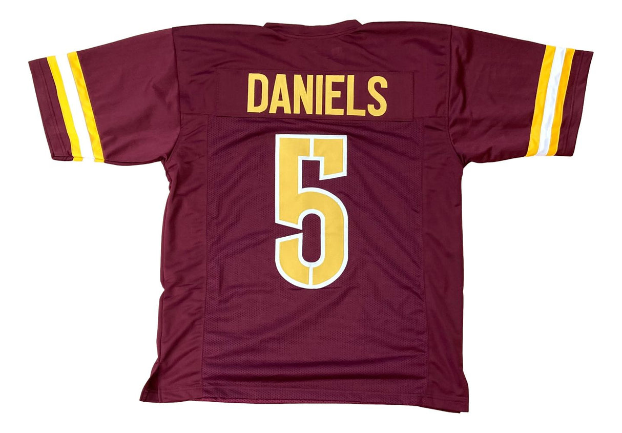 The Sports Integrity Jayden Daniels Washington Burgundy Football Jersey features yellow and white sleeve stripes, with "DANIELS" and the number 5 in bold yellow on the back.