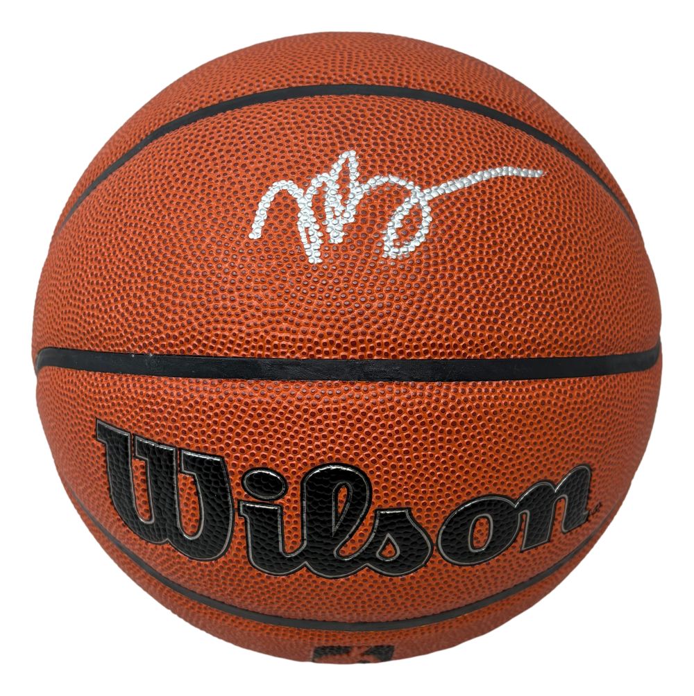 The Sports Integrity Jaylen Brown Boston Celtics Signed Wilson I/O Basketball features a white stylized signature on its textured orange surface with black lettering.