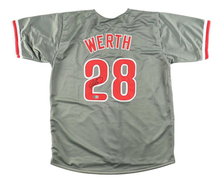 The Sports Integrity Jayson Werth Philadelphia Signed Gray Baseball Jersey features red trim and "WERTH" with #28 in red and white on the back, personally autographed in black ink. The jersey is shown laid flat, back side facing up.