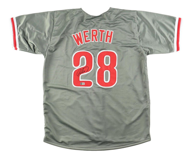 The Sports Integrity Jayson Werth Philadelphia Signed Gray Baseball Jersey features red trim and "WERTH" with #28 in red and white on the back, personally autographed in black ink. The jersey is shown laid flat, back side facing up.