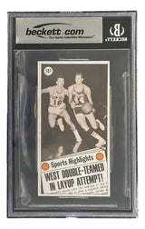 The Sports Integrity Jerry West Signed 1970-71 Topps #107 Lakers Trading Card BAS features West in action, double-teamed by a New York player, highlighting his skill on the court.