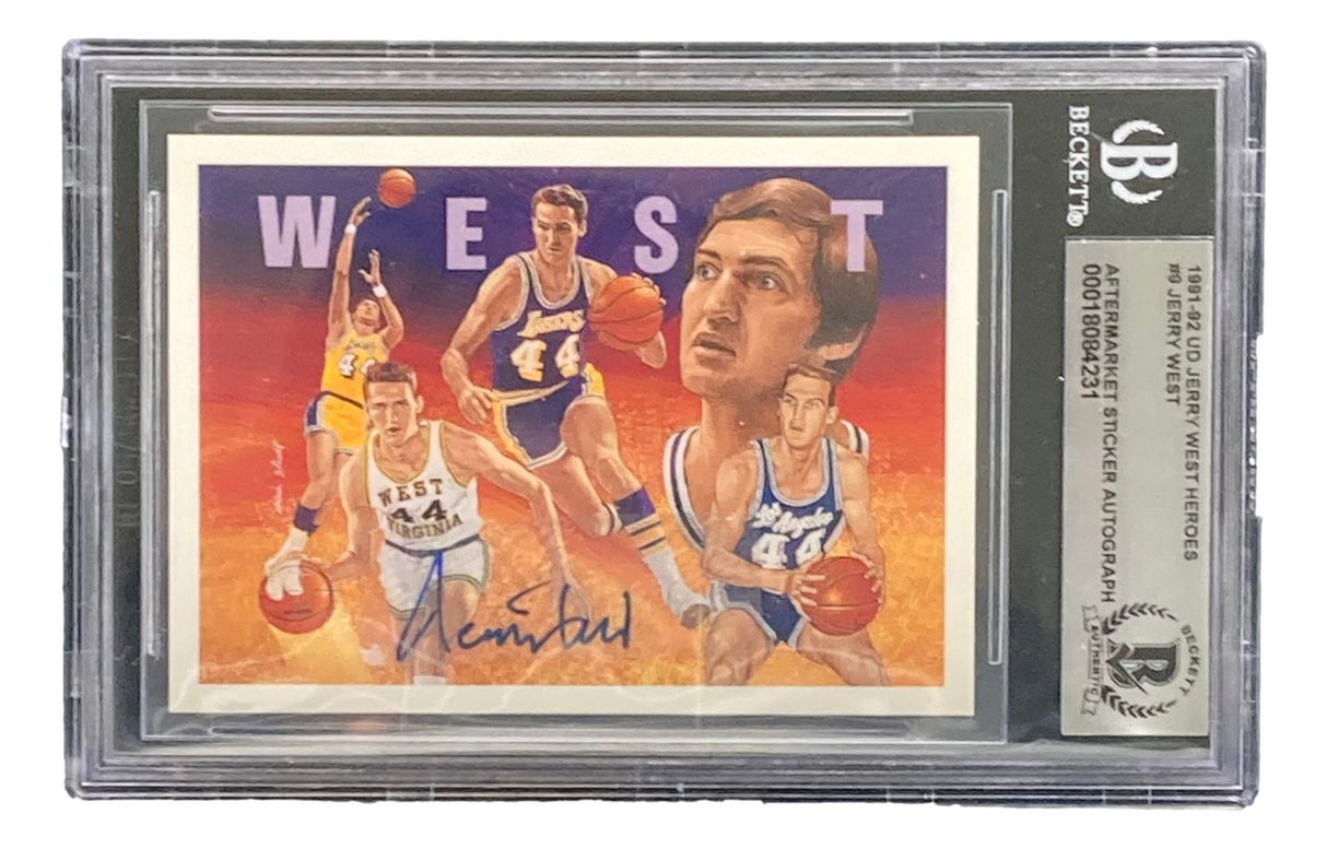 The Sports Integrity Jerry West Signed 1991-92 UD Heroes #9 Lakers Trading Card BAS features illustrated images of Jerry West in a white uniform, his autograph, and comes encased in a Beckett grading case.