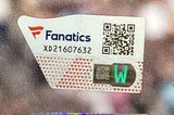 A close-up of a Sports Integrity Fanatics authentication sticker with QR code, serial XD21607632, and holographic features on the Jey Uso Signed Framed 16x20 WWE Wrestlemania 41 Photo And New 4-19-25 Fanatics.