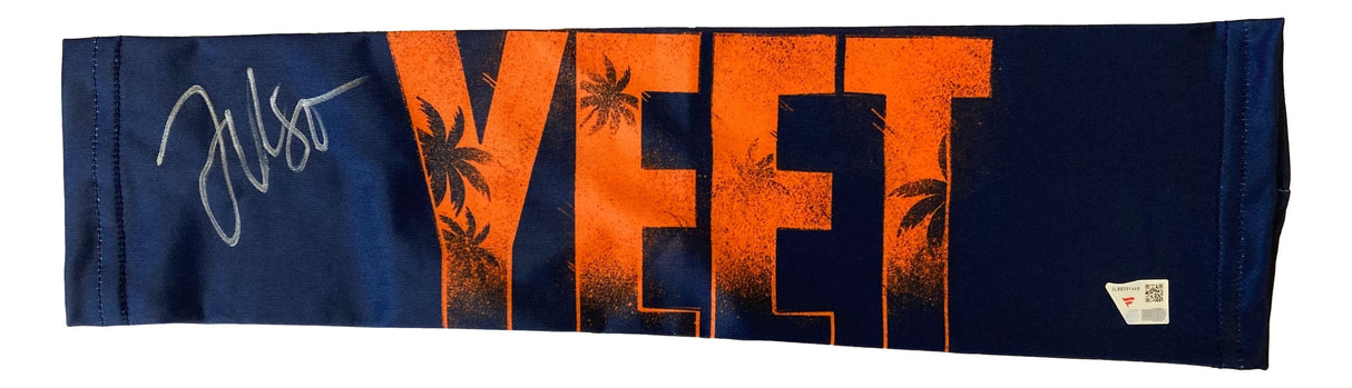 The Sports Integrity Jey Uso Signed WWE Yeet Arm Sleeve features navy blue and orange colors, "YEET" in bold letters, palm tree silhouettes, a silver autograph on the left, and a white tag at the bottom right corner.