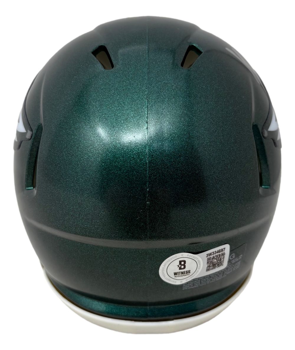 The Jihaad Campbell Signed Philadelphia Eagles Mini Speed Helmet by Sports Integrity is green, viewed from the back, with two top ventilation slits and a sticker showing a QR code and certification details near the bottom.