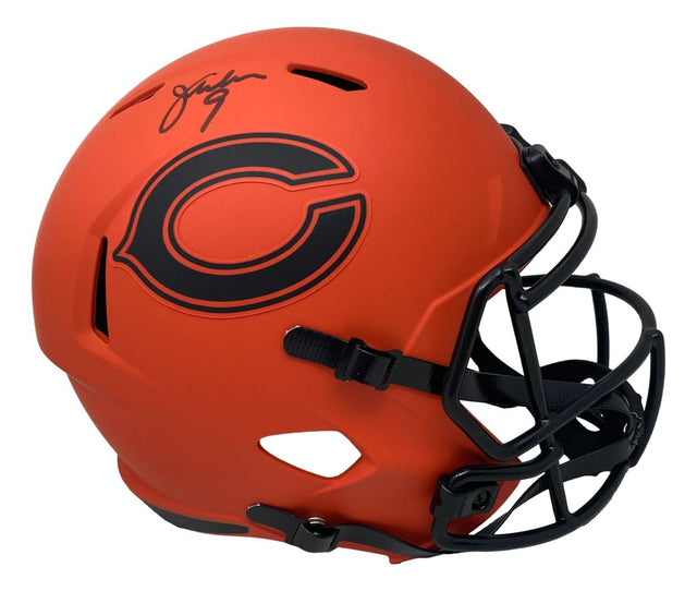 The Sports Integrity Jim McMahon Signed Chicago Bears Full Size Rave Replica Speed Helmet features an orange design with a black logo, black facemask, and a bold black autograph on top.