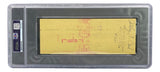 The Joe Frazier Boxing Signed Slabbed Bank Check #4557 by Sports Integrity is a yellow check with signatures and a red bank stamp, encased in a PSA/DNA holder featuring a barcode and QR code on the left side.