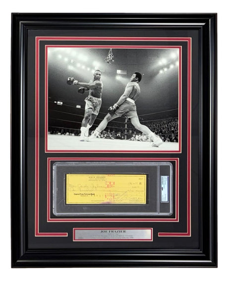 Sports Integrity presents the Joe Frazier Boxing Signed Framed Slabbed Bank Check #4617 PSA/DNA, featuring a black-and-white photo of two boxers in the ring above an autographed yellow check and descriptive plaque.