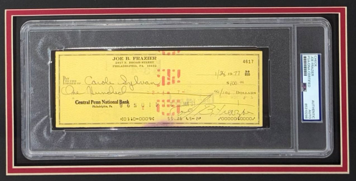 The Sports Integrity Joe Frazier Boxing Signed Framed Slabbed Bank Check #4617 features a PSA/DNA authenticated Central Penn National Bank check, encased in a protective display with black and red borders.