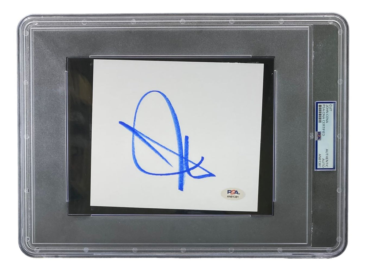 The John Cena Signed Slabbed WWE Large Cut Signature by Sports Integrity features a bold blue autograph on a white square card, sealed in a PSA holder with sticker AN81381 visible at the bottom right.