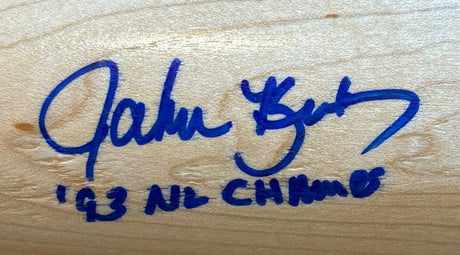 A John Kruk Phillies Signed Tan Louisville Slugger Bat with “93 NL Champs” inscribed, authenticated by BAS, from Sports Integrity.