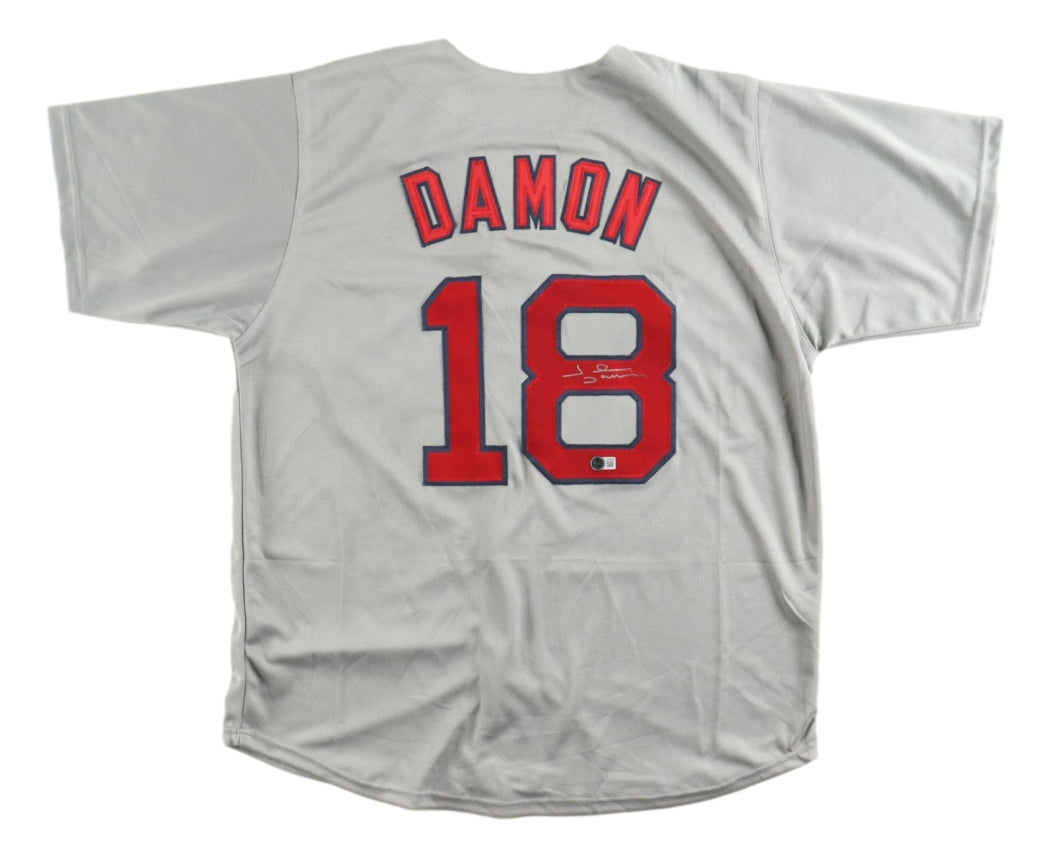 A Sports Integrity Johnny Damon Boston Signed Gray Baseball Jersey BAS, laid flat to display DAMON and the number 18 in red with blue outline on the back.