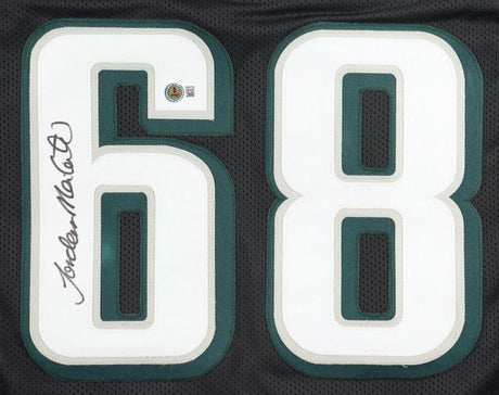 Close-up of a Jordan Mailata Philadelphia Signed Black Football Jersey by Sports Integrity, featuring large white and green number 68 and a signature in black ink on the number 6.