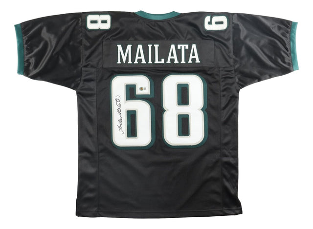 The Sports Integrity Jordan Mailata Philadelphia Signed Black Football Jersey BAS features Mailata's name and #68 in large white print with green-accented numbers and sleeve trim, plus his signature on the left side of the number.