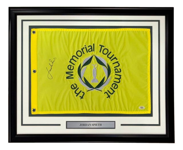 Sports Integrity Jordan Spieth Signed Framed The Memorial Tournament Golf Flag with PSA/DNA Hologram, featuring a yellow flag with black and green tournament logo, Spieth’s black signature on the left, and a name plaque below.