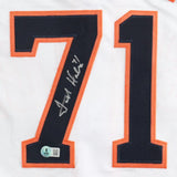 A Sports Integrity Josh Hader Houston Signed White Baseball Jersey features large navy blue and orange number 71, a silver autograph across the 7, and a BAS authentication sticker at the bottom of the 7.