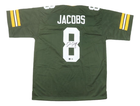 The Sports Integrity Josh Jacobs Green Bay Signed Green Football Jersey BAS features yellow and white sleeve stripes, “JACOBS” and number 8 on the back, with the number 8 autographed in black marker.