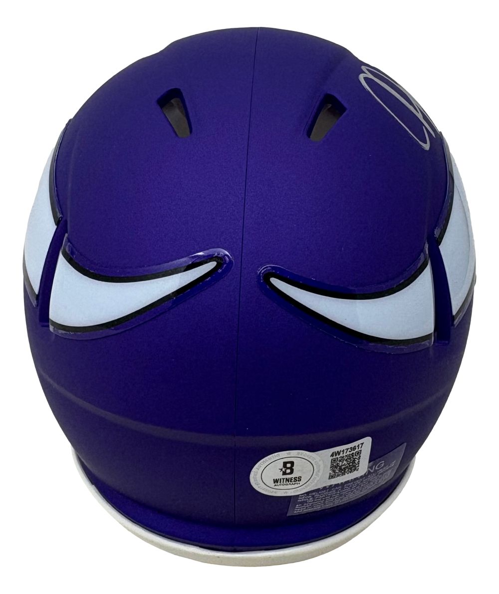 The Sports Integrity Justin Jefferson Signed Minnesota Vikings Mini Speed Helmet BAS features a purple shell, white and black stylized wing decals, top ventilation slits, and a certification sticker near the bottom.