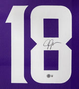 Close-up of a Justin Jefferson Minnesota Signed Framed Purple Football Jersey by Sports Integrity, featuring a large white number 18. The number 8 displays his black ink signature with an authentication sticker below it.