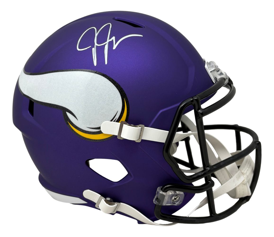 The Justin Jefferson Signed Minnesota Vikings Full Size Replica Speed Helmet by Sports Integrity features a purple shell with white and yellow Viking horn logo, white facemask, and Jefferson's autograph on top.