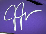 A large, stylized white autograph in marker is featured on a purple Justin Jefferson Signed Minnesota Vikings Full Size Replica Speed Helmet by Sports Integrity.