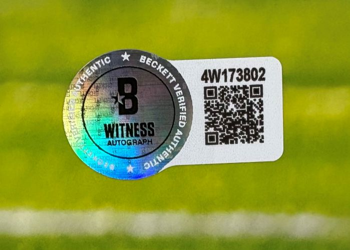 A Beckett Witness Autograph authentication sticker with holographic seal, QR code, and serial number 4W173802 is shown on the Justin Jefferson Signed 16x20 Minnesota Vikings Photo vs Chargers from Sports Integrity.