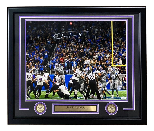 The Sports Integrity Justin Tucker Signed Framed 16x20 Ravens Record Kick Photo (JSA ITP) features Tucker's autograph, Ravens logos, plaques, and captures his record-setting field goal with players and officials looking on.