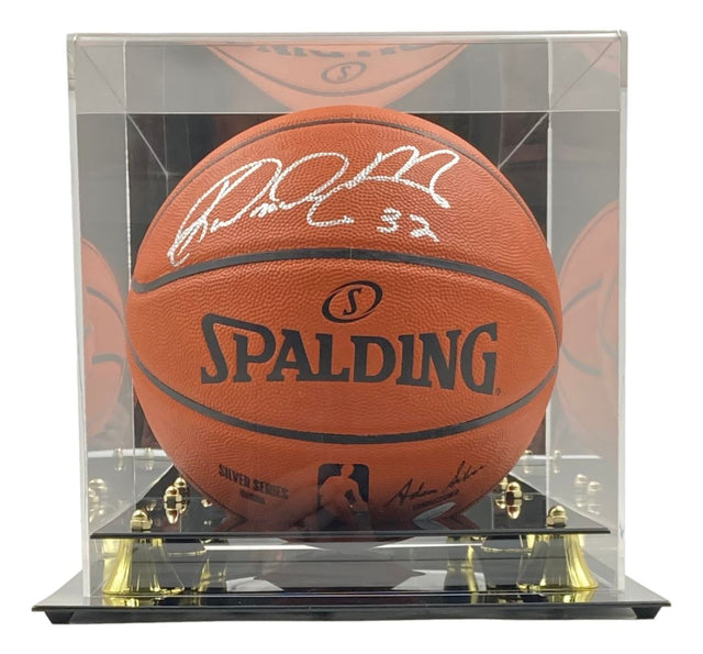 A Karl Malone Utah Jazz Signed Spalding I/O NBA Basketball is displayed in a clear acrylic case with a black and gold base. The ball, authenticated by JSA ITP, features the NBA logo and is offered by Sports Integrity.