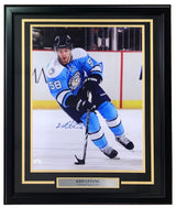 The Sports Integrity Kris Letang Signed Framed 16x20 Pittsburgh Penguins Photo (JSA) shows Letang, #58, in a blue jersey skating on ice. Includes autograph and nameplate with Kris Letang’s name and team.