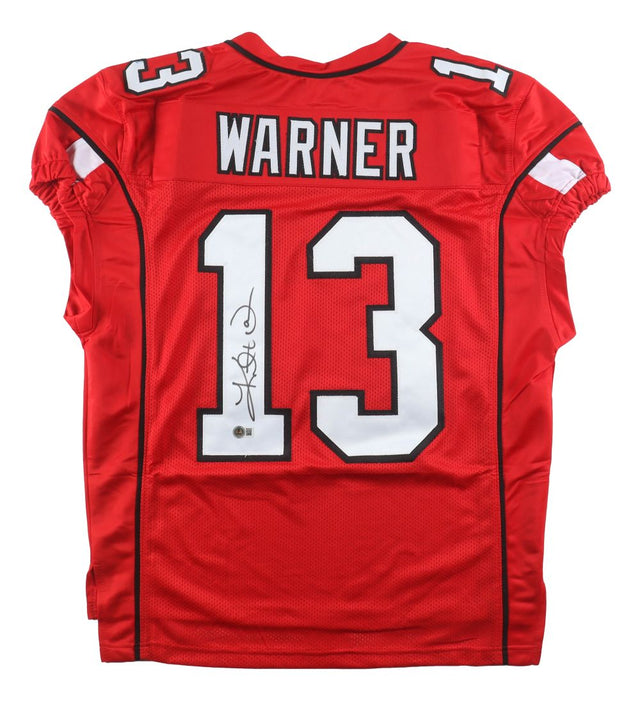 The Sports Integrity Kurt Warner Arizona Signed Red Pro-Cut Football Jersey BAS features "WARNER" and number 13 in white/black, with the number autographed in black marker on the lower left back.