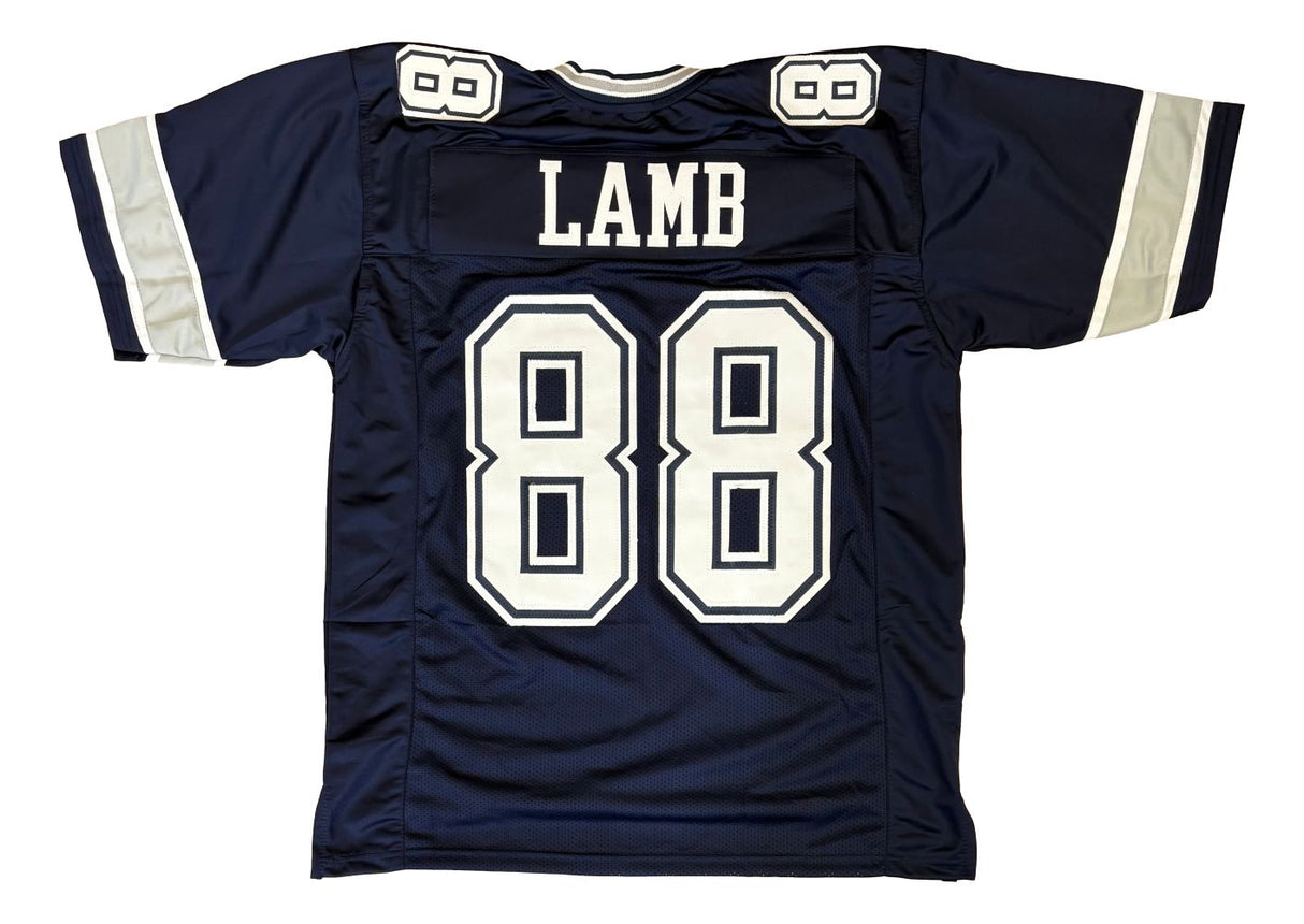 The Sports Integrity CeeDee Lamb Dallas Navy Blue Football Jersey features white accents and displays "LAMB" and the number 88 in bold white letters and numbers on the back.