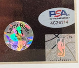 Close-up of three authentication stickers on the Sports Integrity Larry Bird Signed Framed 16x20 Celtics vs Lakers Photo: a holographic Larry Bird AUTHENTICATED sticker, a silver PSA/DNA In-The-Presence code 4C26114, and a silver NBA logo sticker.