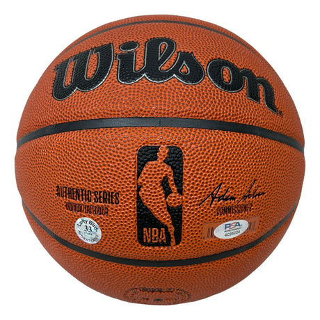 A Larry Bird Boston Celtics signed Wilson NBA basketball by Sports Integrity, featuring a PSA/DNA authentication sticker and printed signature, is displayed on a plain white background.