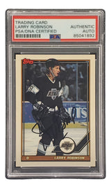 The Sports Integrity Larry Robinson Signed 1991 Topps #458 Los Angeles Kings hockey card is PSA/DNA authenticated, autographed, shows the Topps logo, and comes encased in a protective plastic holder.