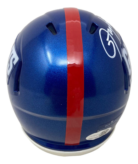 The Sports Integrity Lawrence Taylor Signed New York Giants Mini Speed Helmet features a blue design with a red center stripe, white side decals, and a white signature on top. The image shows the helmet from the back.