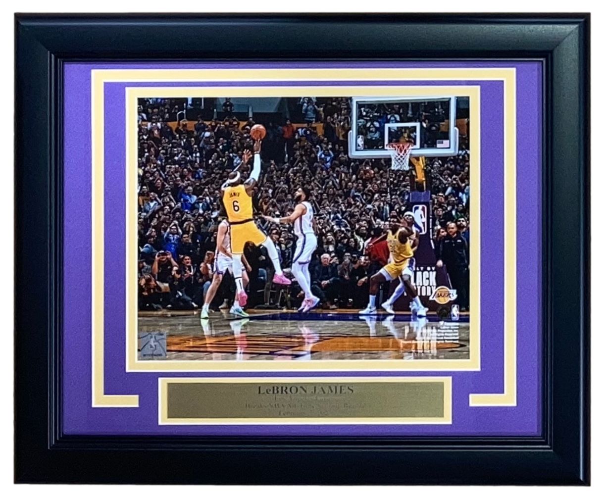 Sports Integrity's Lebron James Framed 8x10 Los Angeles Lakers Scoring Record Photo features LeBron in a yellow jersey, taking a jump shot, with purple and gold matting and a nameplate reading "LeBron James.