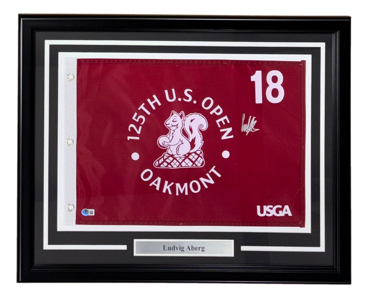 The Sports Integrity Ludvig Aberg Signed Framed 125th PGA US Open Golf Flag features a maroon flag with number 18, squirrel image, signature, and nameplate reading "Ludvig Aberg.